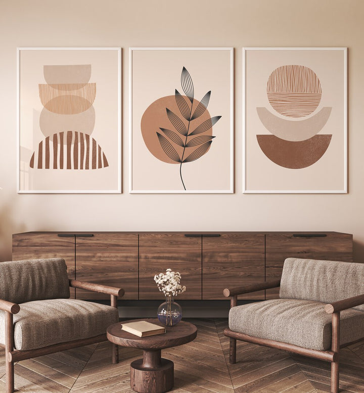 Modern Leaf Geometric Set Set Of 3 Paintings in White Plain Frame placed on a living room wall behind a console table and chairs