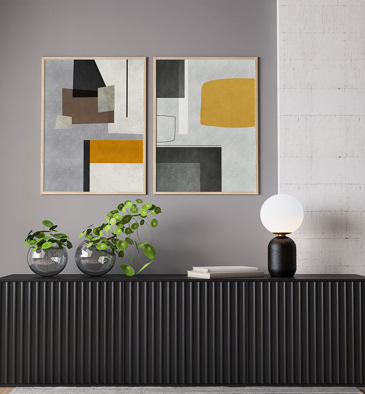 Modern interior with abstract art, plants, and a black console table.