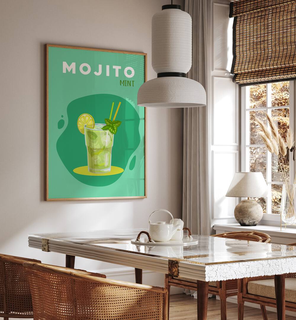 Mojito Mint Cafe Art Prints Cafe Posters in Oak Wood Plain Frame placed on a wall in a dining room area beside a window and behind a dining table