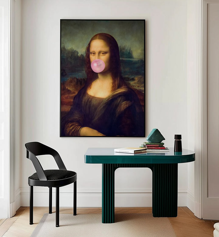 Mona Lisa Bubble Gum Surreal Paintings Surreal Art Prints in Black Plain Frame placed on a White Colored Wall Above a Study Table near a Workspace in the Drawing Room