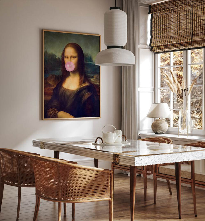 Mona Lisa Bubble Gum Surreal Paintings Surreal Art Prints in Oak Wood Plain Frame placed on a Cream Colored Wall near a Dining Table in the Dining Room