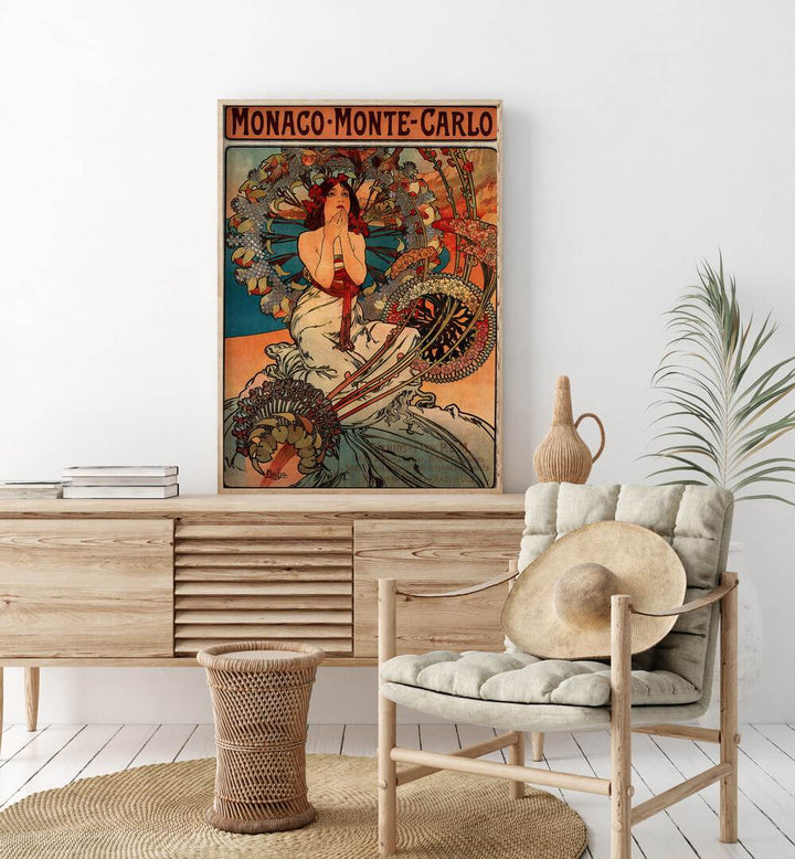 Monaco Monte Carlo  Vintage Travel Posters in Oak Wood Plain Frame placed on a console table behind a chair