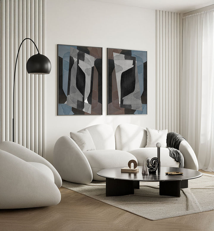Modern living room with white sofa, abstract art, and a floor lamp.