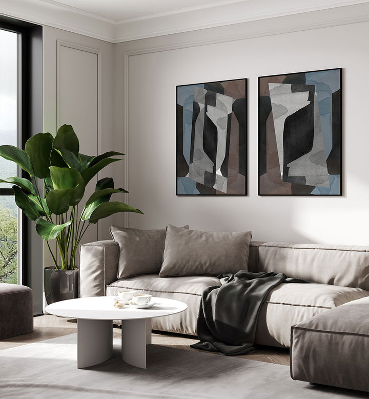 Modern living room with a gray sectional sofa, abstract art, and a plant.