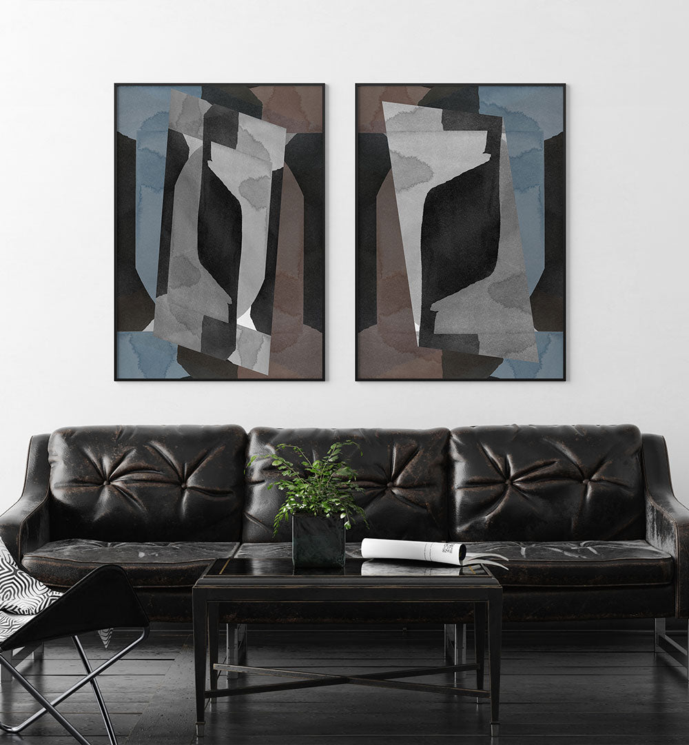 Living room with a black leather sofa, abstract art on the wall, and a small table with a plant.
