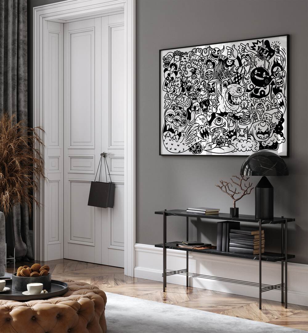 Monster Mayhem Doodle Art Painting in Black Plain Frame placed on wall behind a black table beside a door