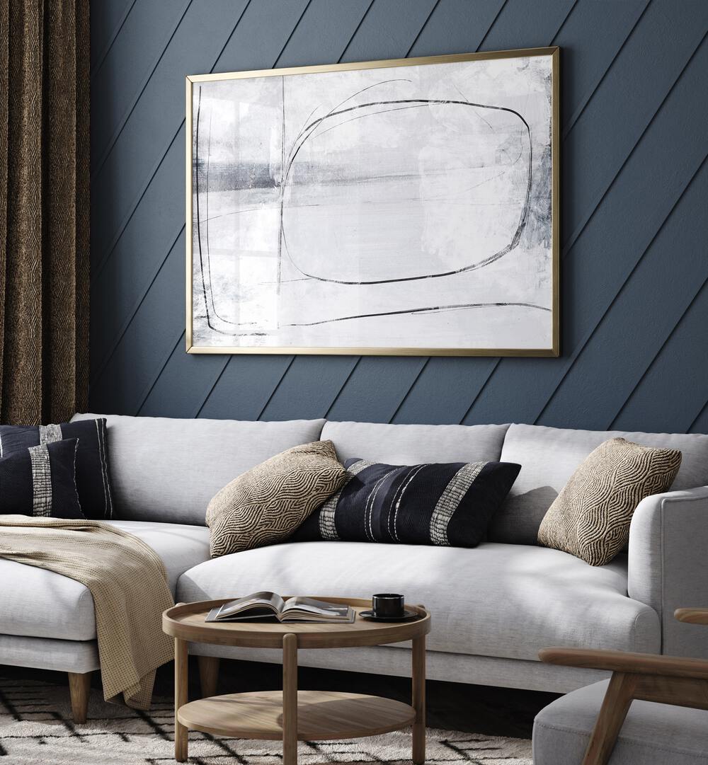 Mood By Dan Hobday Abstract Art Abstract Paintings in Gold Plain Frame placed on a Blue Colored Wall near a White Sofa in the Living Room