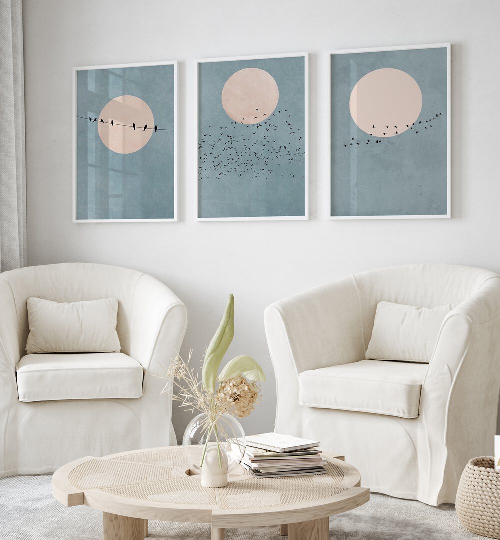 Moon Set Set Of 3 Paintings in White Plain Frame placed on a wall living room wall behind sofas