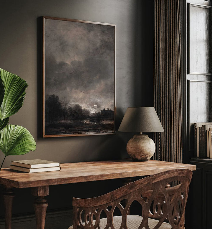 Moonlit Expanse Gothic Wall Art Prints in Oak Wood Plain Frame hanging on wall above study table beside a window.