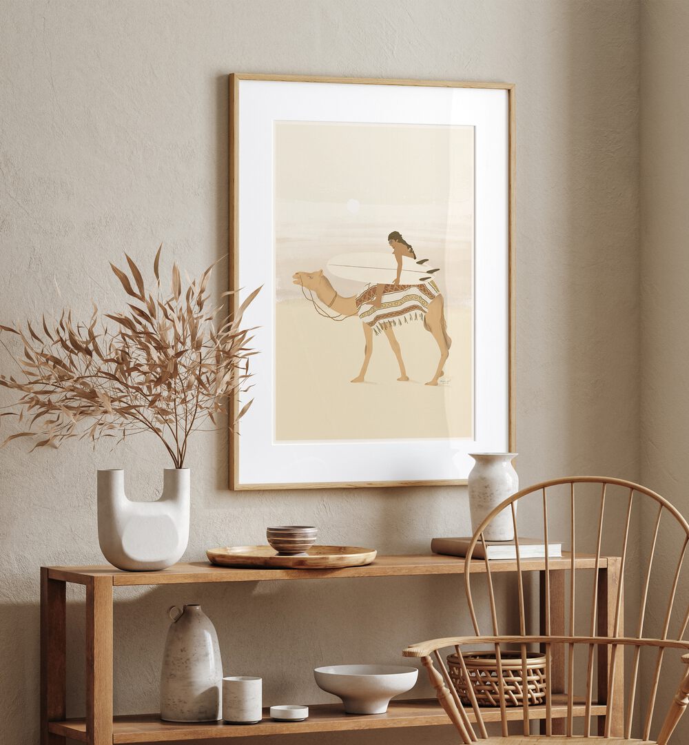 Moroccan Surfing By Andi Bell Beach Prints in Oak Wood Frame With Mount on a cream wall placed above a table