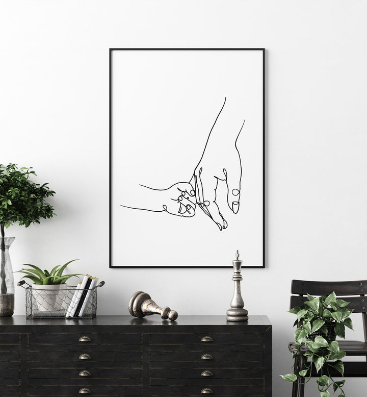 Mother and Daughter by Hanna Lee Tidd Line Art Paintings Line Art Prints in Black Plain Frame placed on a wall behind a table