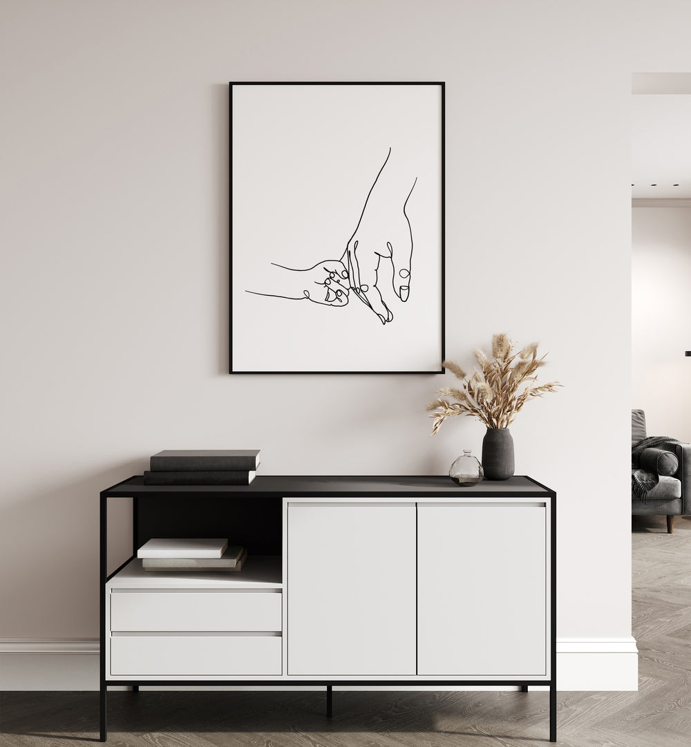 Mother and Daughter by Hanna Lee Tidd Line Art Paintings Line Art Prints in Black Plain Frame placed on a wall behind a table