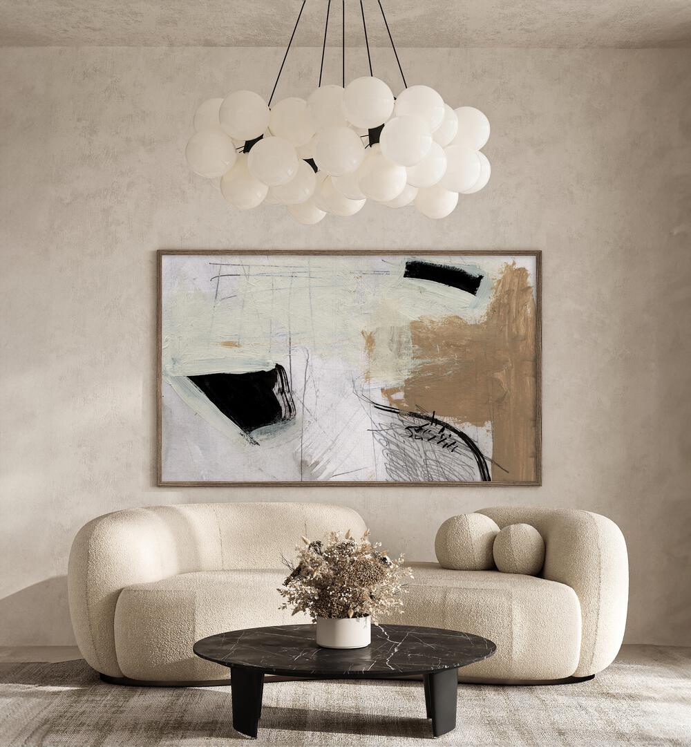 Motion By Dan Hobday Abstract Art Abstract Paintings in Dark Wood Plain Frame placed on a Cream Colored Wall near a Beige Sofa in the Living Room