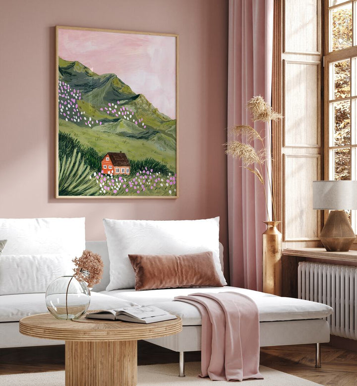 Mountain House By Sarah Gesek Landscape Art Prints in Oak Wood Plain Frame placed on a living room wall beside a window and behind a sofa