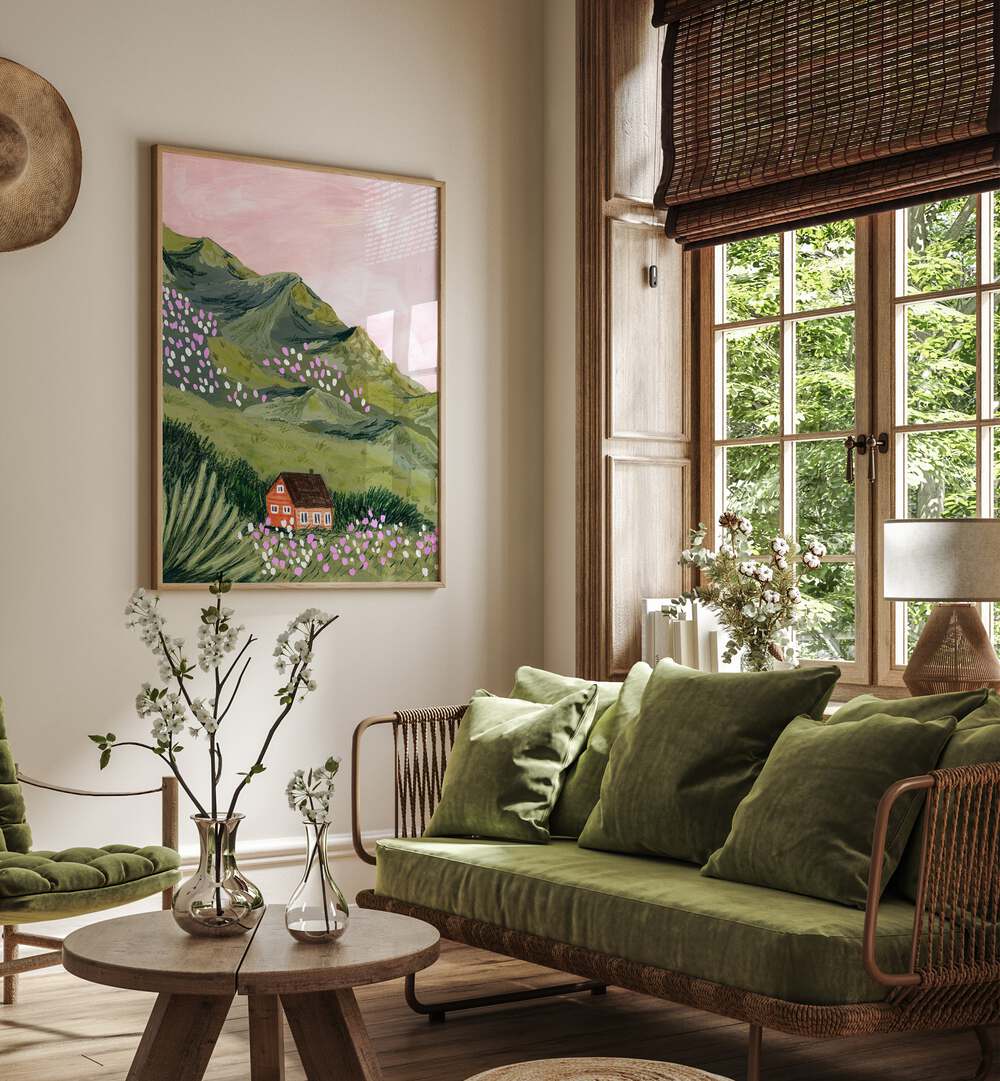 Mountain House By Sarah Gesek Landscape Art Prints in Oak Wood Plain Frame placed on a living room wall beside a window and a sofa