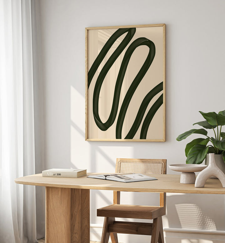 Nana by Yopie Studio Abstract Paintings Abstract Art Prints in Oak Wood Plain Frame placed on a wall behind a study table