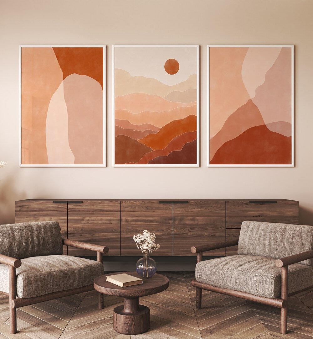 Nature Escapes Set Of 3 Paintings in White Plain Frame placed on a living room wall behind a console table