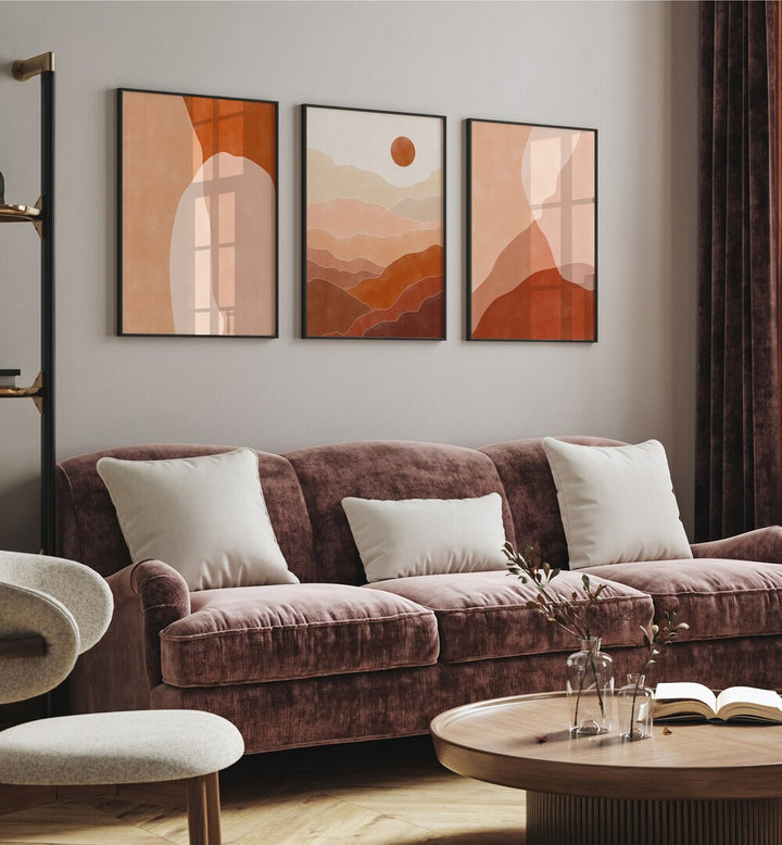 Nature Escapes Set Of 3 Paintings in Black Plain Frame placed on a wall behind a sofa for living room