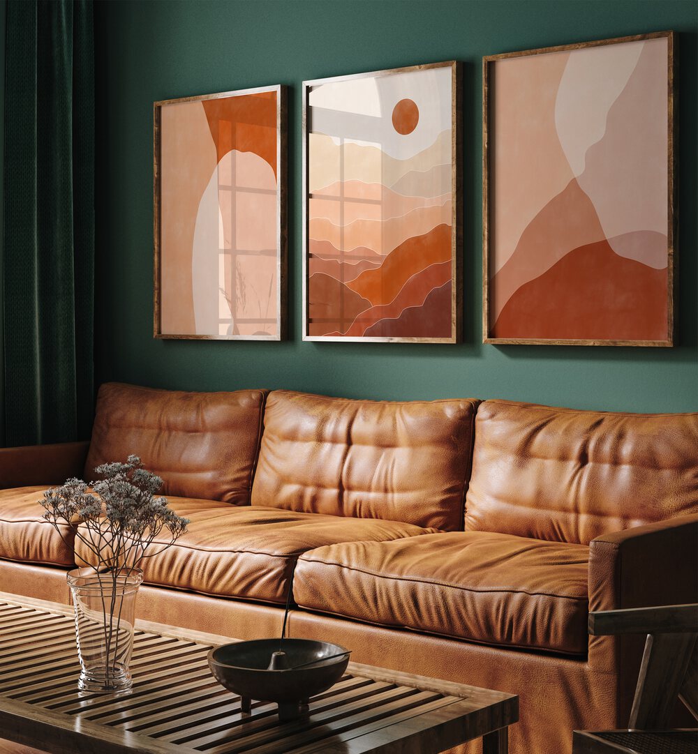 Nature Escapes Set Of 3 Paintings in Oak Wood Plain Frame placed on a living room wall behind a sofa