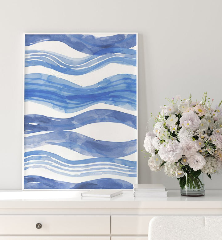 Nautical Notes V Beach Prints Coastal Wall Art in White Plain Frame placed on a white table beside a flower pot