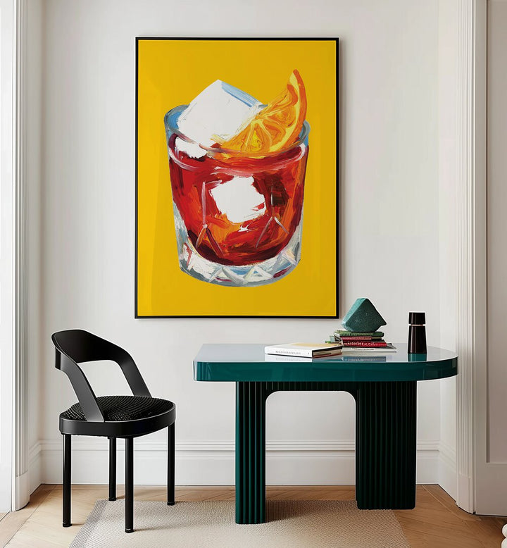 Negroni on Sunshine by Alice Straker Bar Posters Bar Art Prints in Black Plain Frame placed on a wall behind a study table