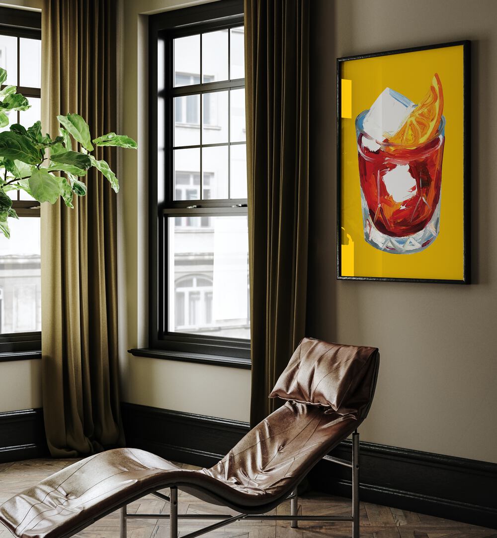 Negroni on Sunshine by Alice Straker Bar Posters Bar Art Prints in Black Plain Frame placed on a living room wall behind a chair and beside a window