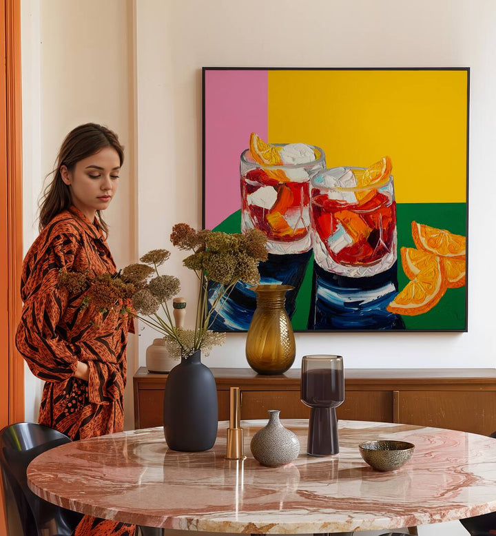 Negronis I by Alice Straker Kitchen Posters Kitchen Art Prints in Black Plain Frame placed on a wall behind a dining table  for dining area