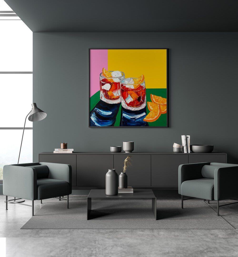 Negronis I by Alice Straker Kitchen Posters Kitchen Art Prints in Black Plain Frame placed on a wall behind a grey console table 