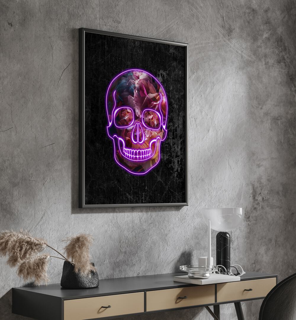 Neon Halloween Skull By Sarah Manovski Botanical Art Print in Black Plain Frame placed on a wall behind a console table