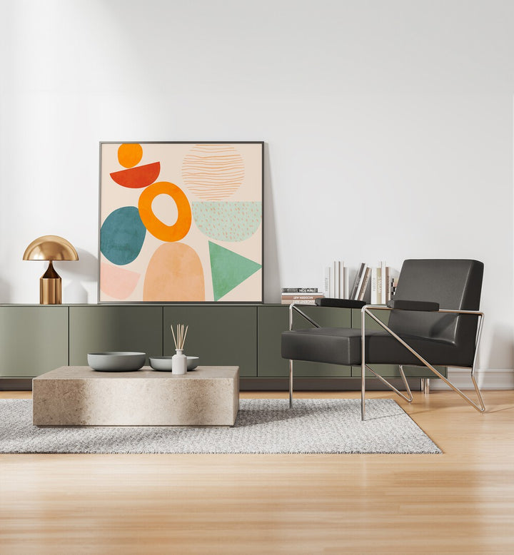 New Shapes Play II By Ana Rut Bre Abstract Art Abstract Paintings in Black Plain Frame placed on a Console Table near a White Colored Wall in the Drawing Room