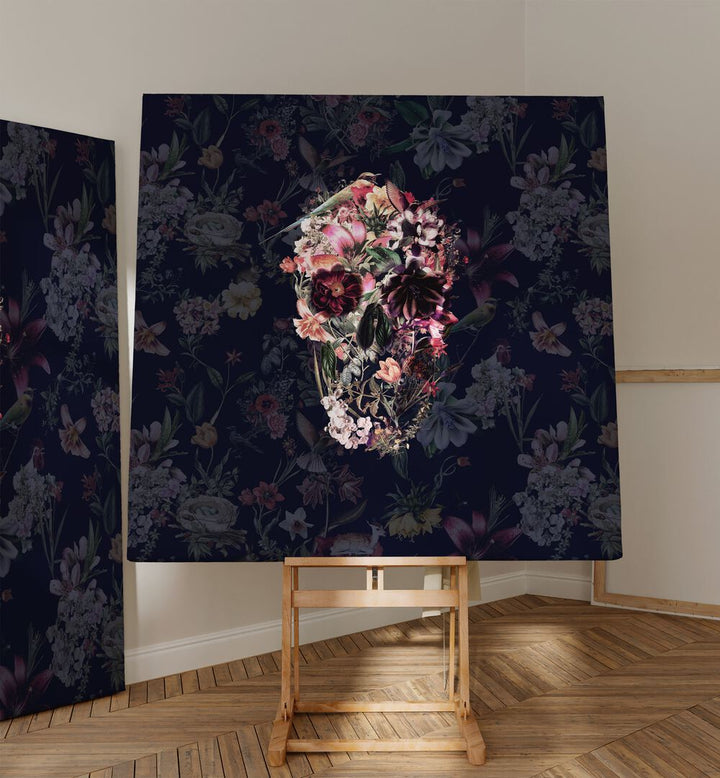 New Skull Dark Botanical Art Prints Floral Paintings in Gallery Wrap  placed on a easel stand beside an artwork