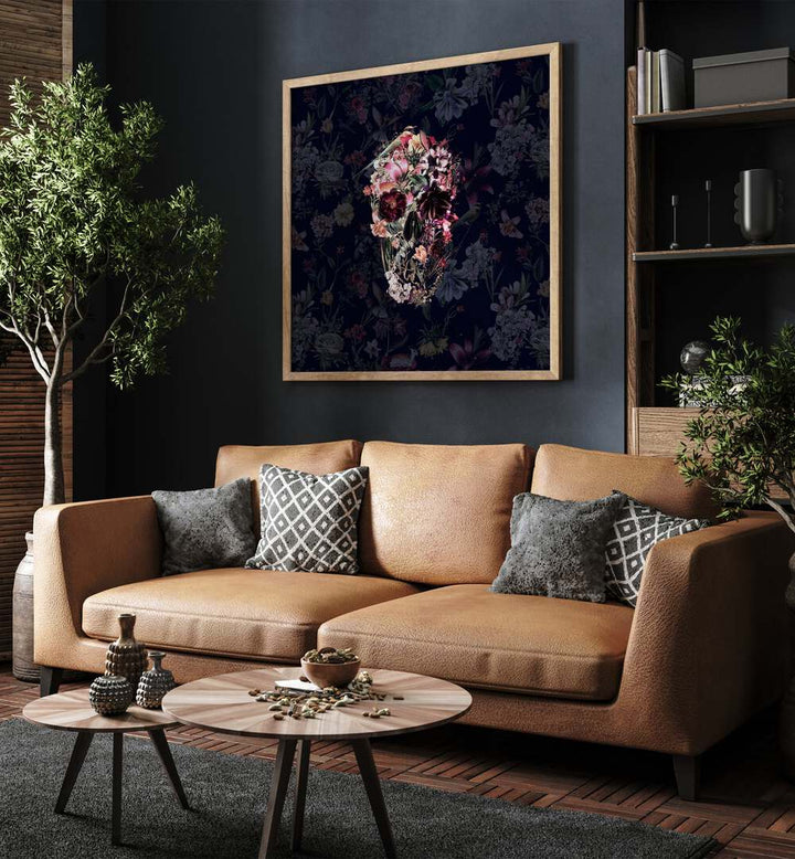 New Skull Dark Botanical Art Prints Floral Paintings in Oak Wood Plain Frame placed on a living room wall behind an orange sofa