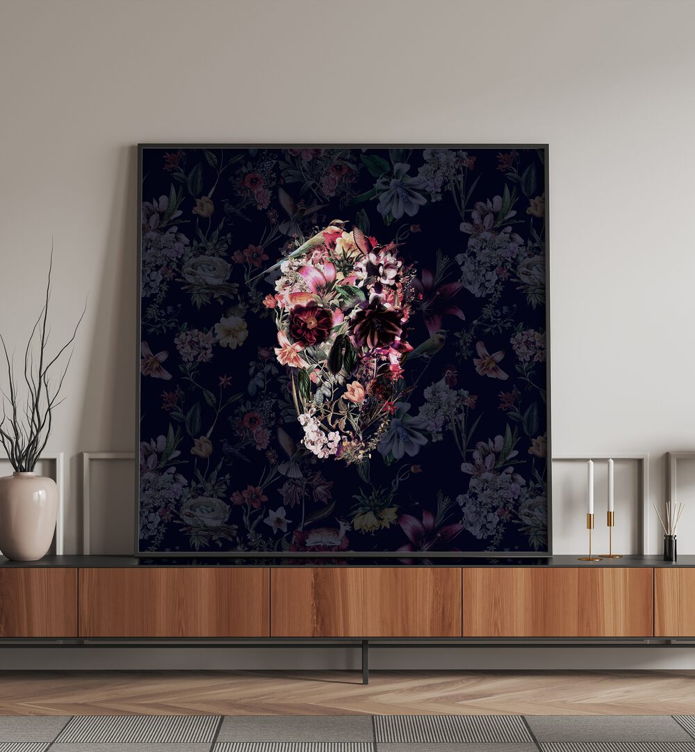 New Skull Dark Botanical Art Prints Floral Paintings in Black Plain Frame placed on a shelf beside a pot and a candle