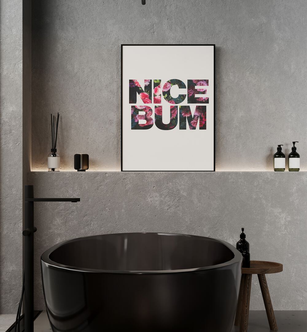 Nice Bum By Sarah Manovski Quotes and Typography Poster in Black Plain Frame placed on a wall behind a black tub for bathroom