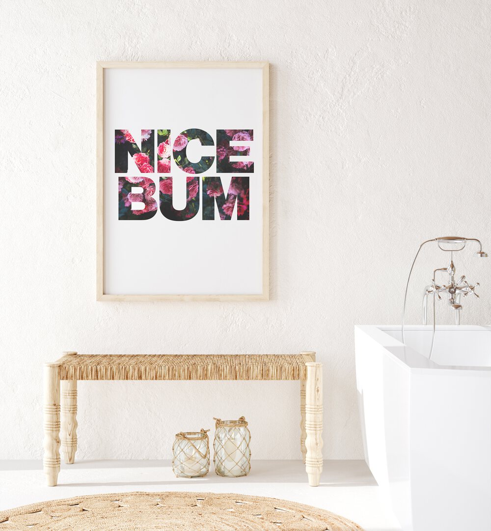 Nice Bum By Sarah Manovski Quotes and Typography Poster in Oak Wood Plain Frame placed on a wall beside a white tub for bathroom