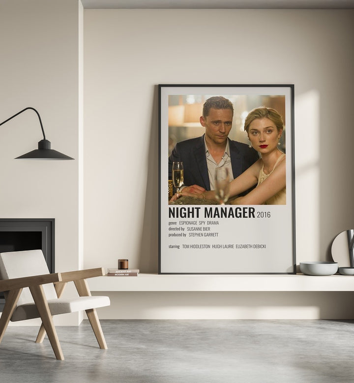 Night Manager 2016 Movie Posters in Black Plain Frame place on a wall behind a chair beside lamp