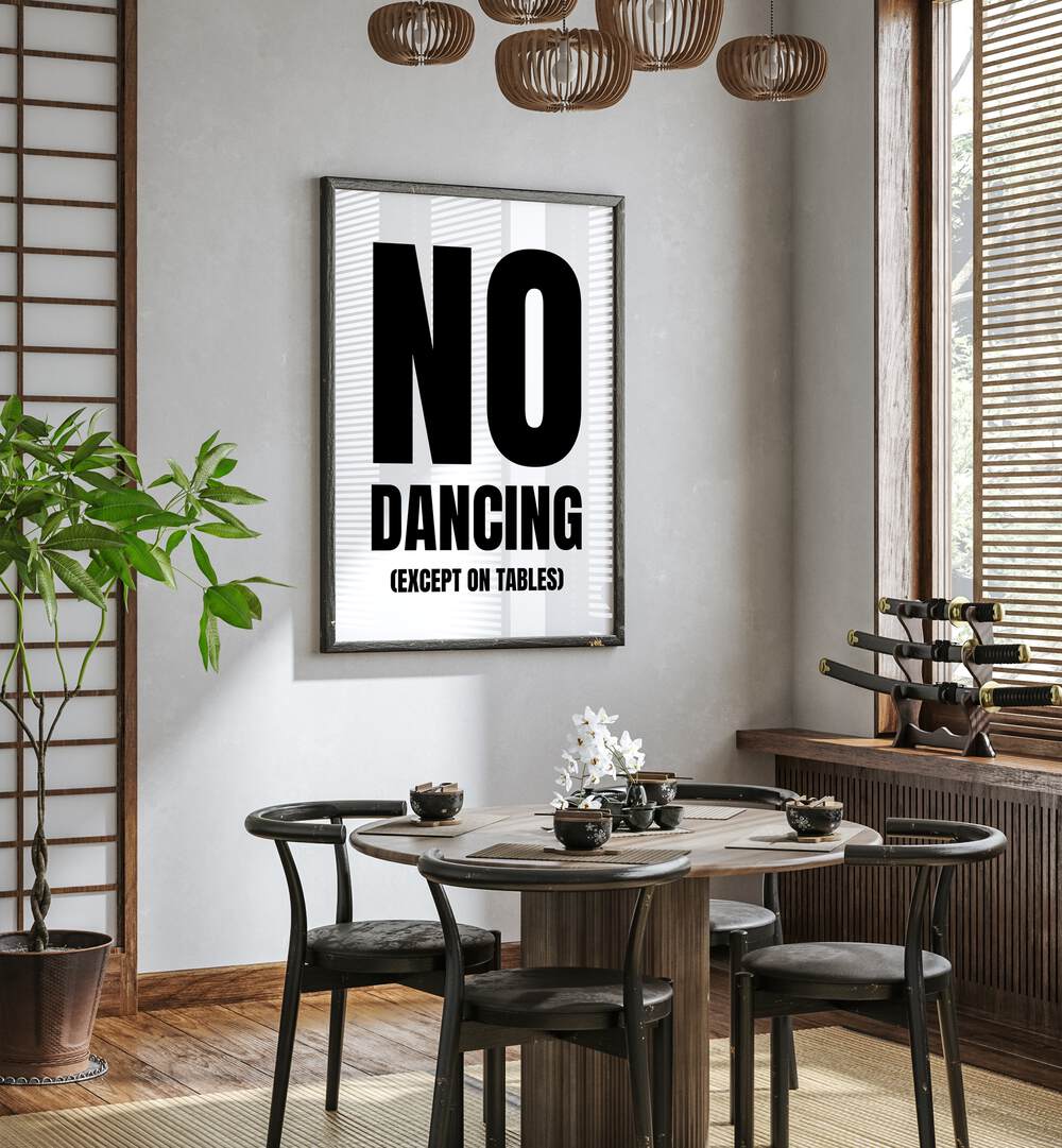 No Dancing by Athene Fritsch Quotes and Typography Posters in Black Plain Frame placed on a wall in a dining room area beside a window and behind a dining table