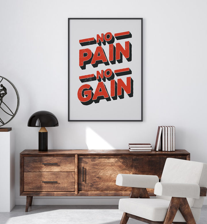 No Pain No Gain Quotes and Typography Posters in Black Plain Frame placed on a wall in a room behind a console table