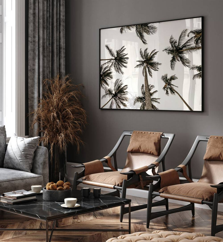 Noir Nirvana Beach Prints Coastal Wall Art in Black Plain Frame placed on a wall behind chairs