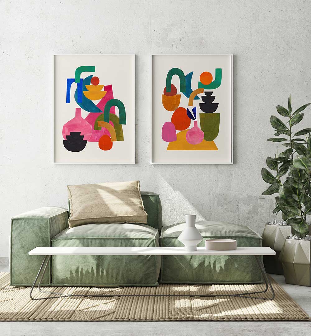 Modern living room with abstract art on the wall, a green sofa, and a white coffee table.