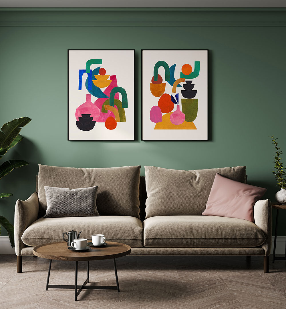 Living room with a beige sofa, round wooden coffee table, and abstract art on a green wall.
