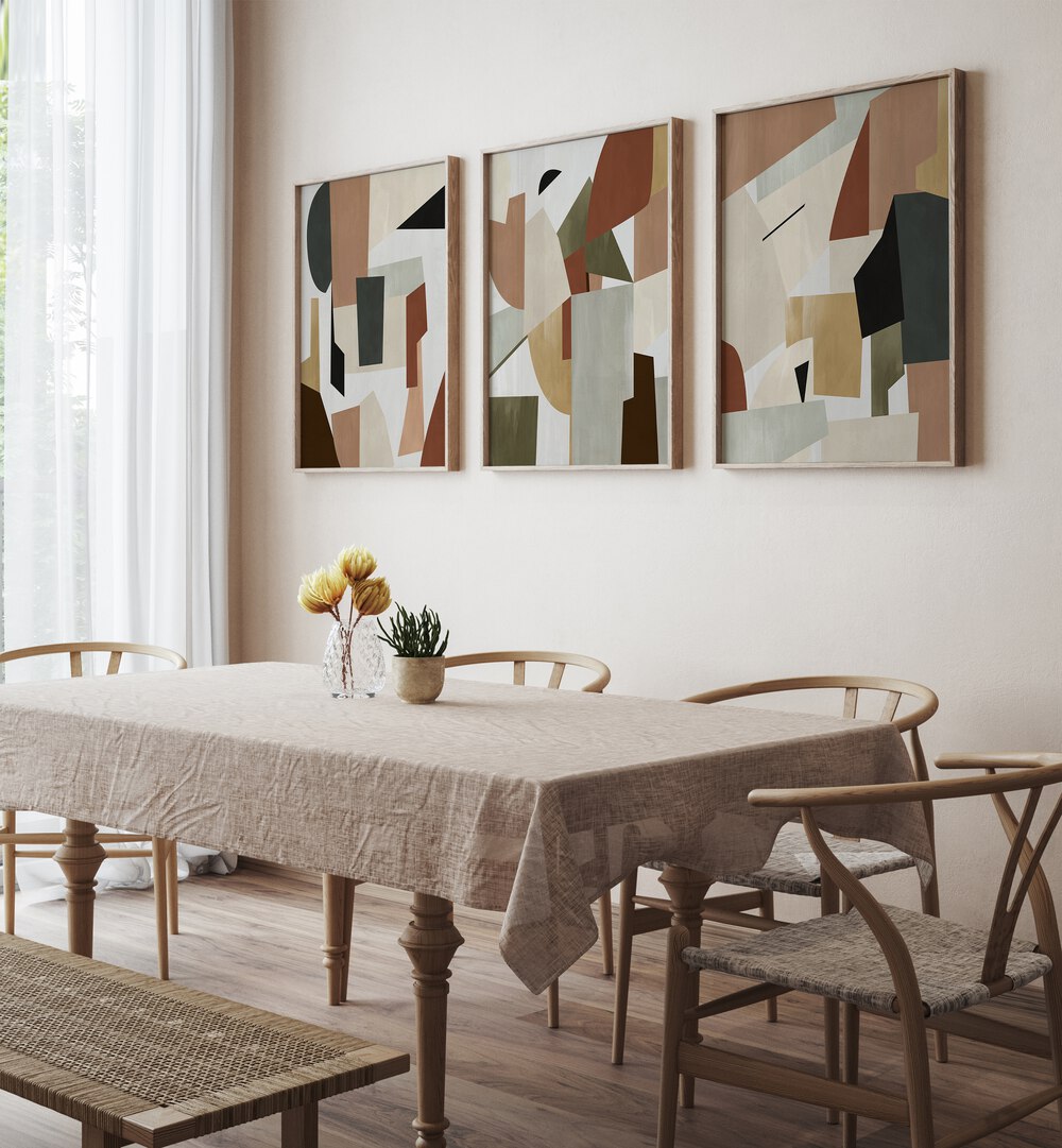 Nordic Shapes Set Set Of 3 Paintings in Oak Wood Plain Frame placed on a wall behind a dining table and beside a window for dining area