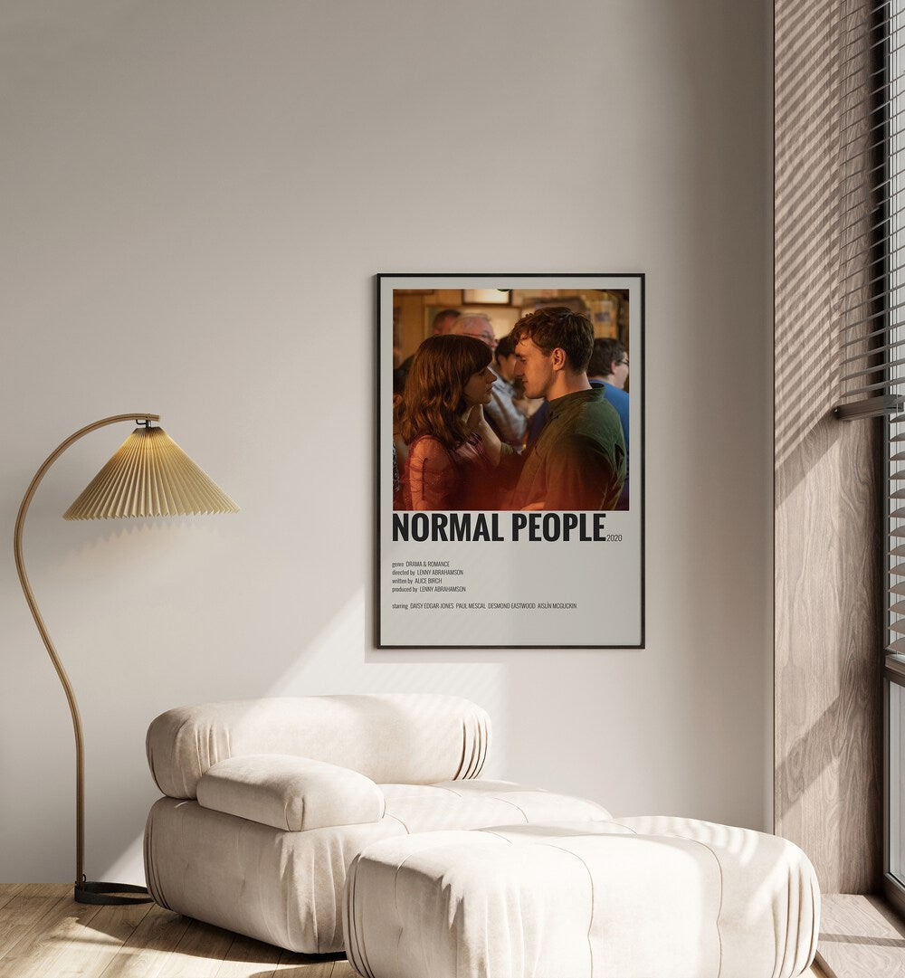 Normal People I Movie Posters in Black Plain Frame placed on a white wall beside a window and behind a sofa