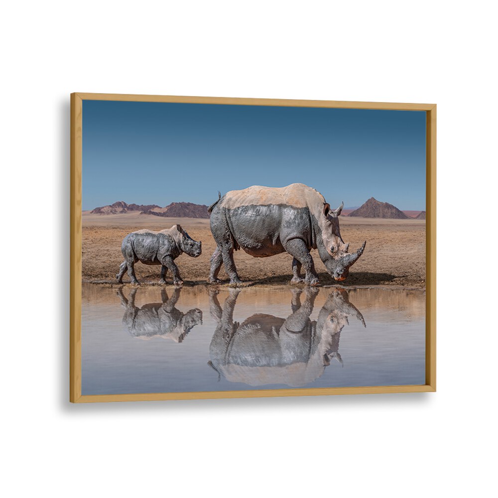 Stunning RHINOS WALK, PHOTOGRAPHY PRINTS showcasing a mother and calf by a serene waterhole, perfect for wildlife lovers.