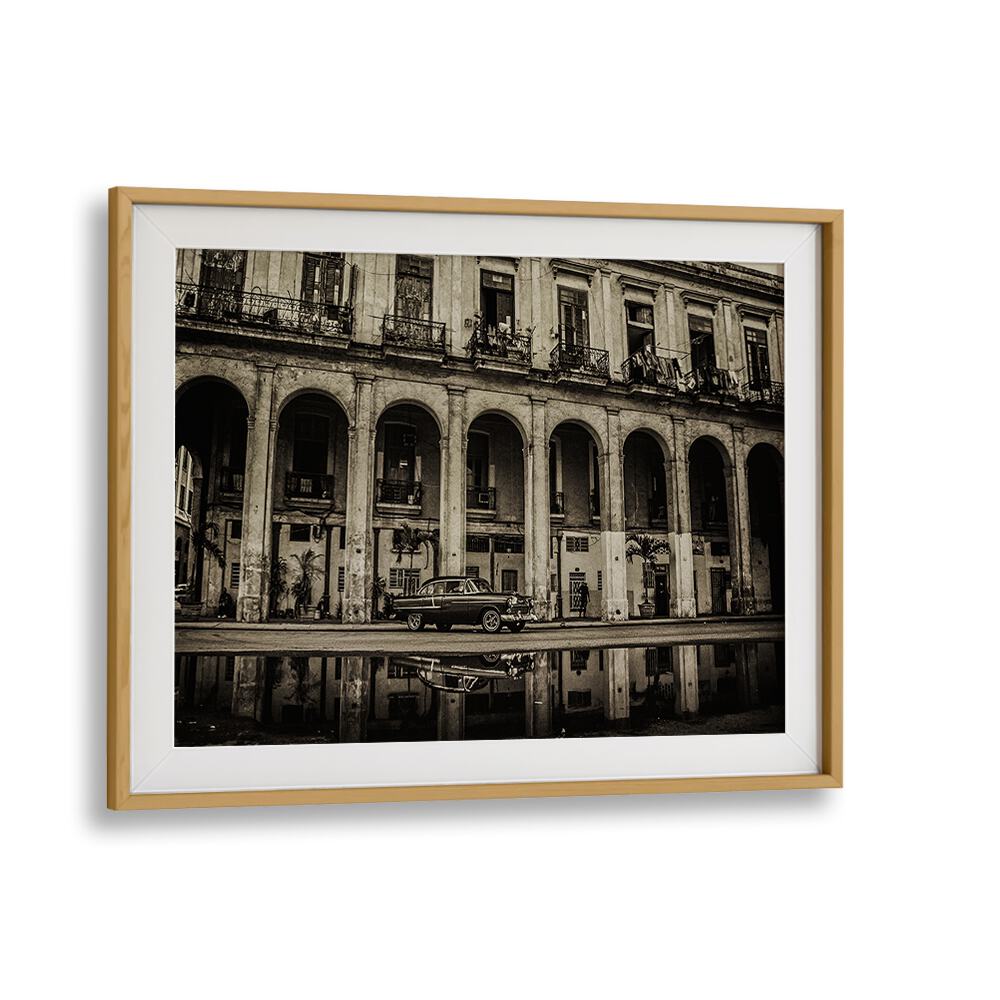 HABANA STREET VIII, PHOTOGRAPHY PRINTS showcase a vintage car against a historic urban backdrop, capturing city life essence.