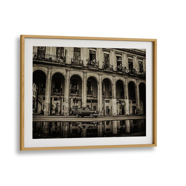 HABANA STREET VIII, PHOTOGRAPHY PRINTS showcase a vintage car against a historic urban backdrop, capturing city life essence.