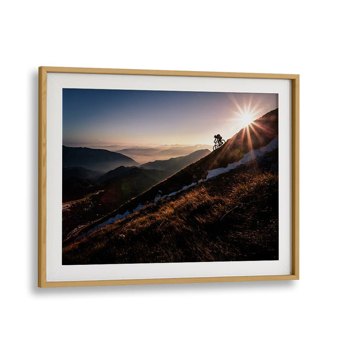 Breathtaking LAST RAYS, PHOTOGRAPHY PRINTS showcasing a cyclist against stunning mountain scenery at sunset.