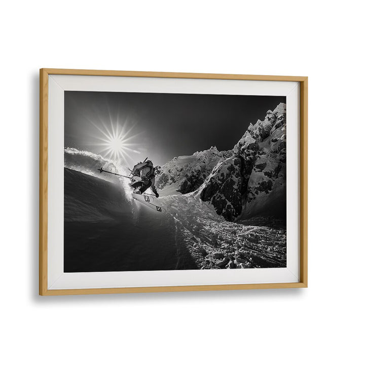Dynamic skiing action captured in SNOW SPLASH OVER THE EDGE, PHOTOGRAPHY PRINTS, showcasing thrilling winter sports.