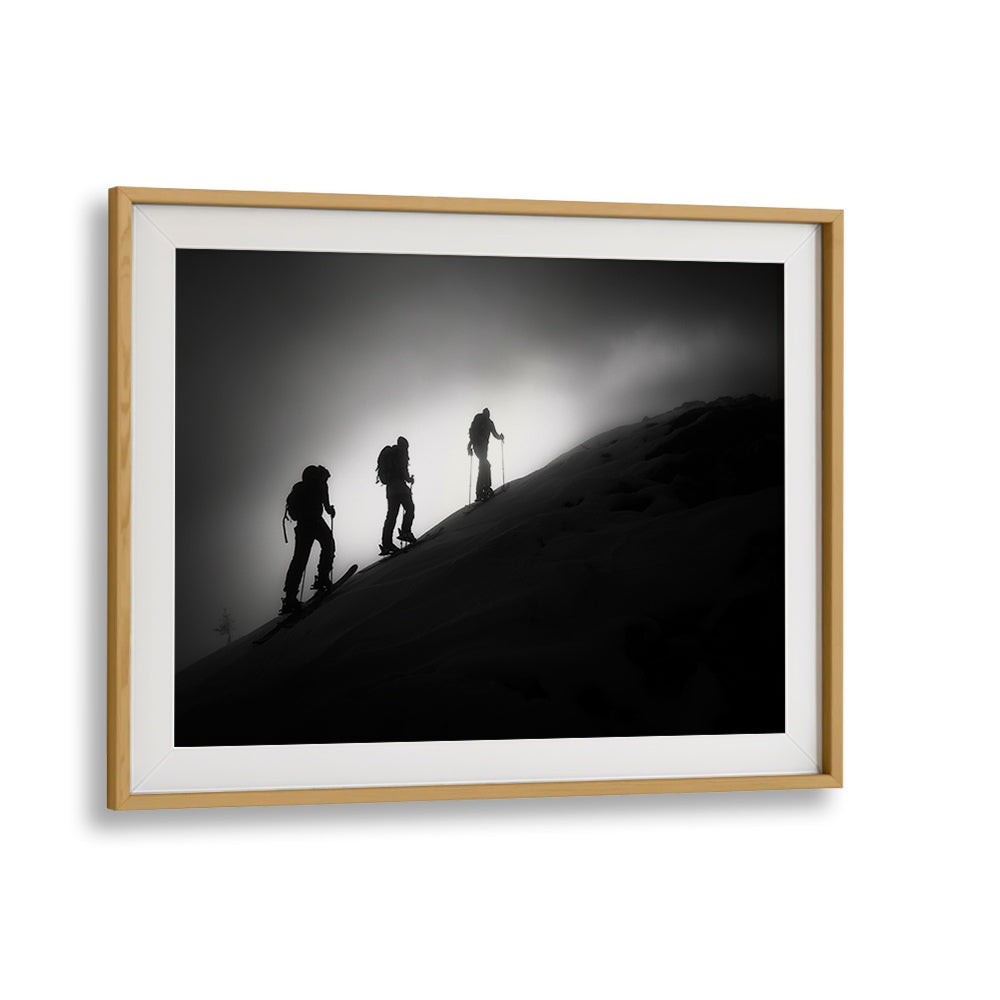 Framed STEP BY STEP, PHOTOGRAPHY PRINTS showcasing silhouetted skiers ascending a mountain, perfect for any art lover.