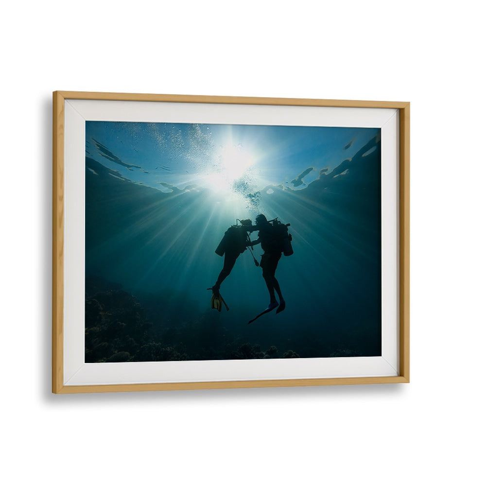Underwater scene showcasing divers illuminated by sunlight, featuring TRUST ME, PHOTOGRAPHY PRINTS for art lovers.
